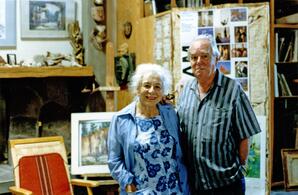 A photograph of Reva and Leonard Brooks in Leonard's studio.