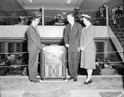 Presentation of Admiral Console at Modern Furniture Limited. Mr. Hendin Mgr. Mr. and Mrs W.J. Hill (left to right) - V25.5-2-220