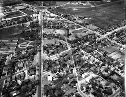 Looking N.W. up Princess St. showing old water tower and traffic circle at top of picture. - V25.6-1-4-41