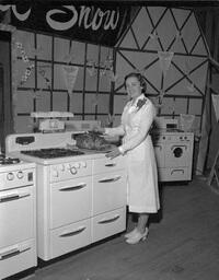 Spring Style Show - woman standing at a stove