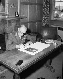 Field Marshall Montgomery seated at a desk