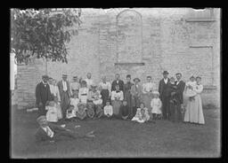 [Group of Thirty-Three People Behind a Church]