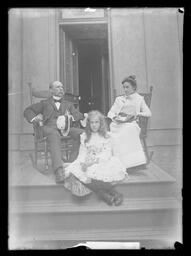 [Man, Woman and Girl On A Porch]