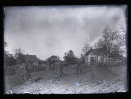 [Stone Farm House with Corn Stalks and Fields]