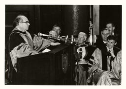 Item is an image of Alfred Bader giving his convocation speech on the occasion of receiving an honorary degree from Queen's University.